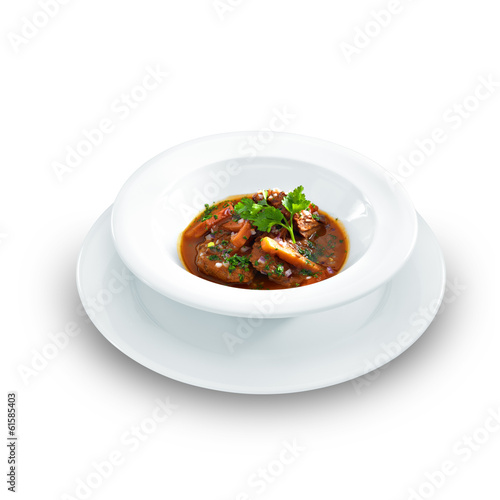 Rich hot hungarian beef goulash with traditional topping served