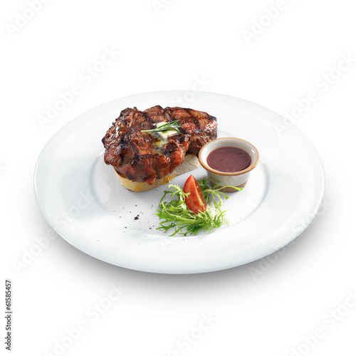 Healthy well done meat steak with butter and herbs served with b