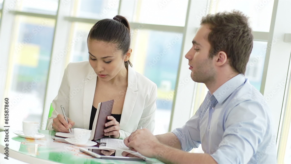 businessman and businesswoman exchanging contacts businessman and businesswoman exchanging contacts