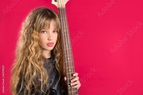 Blond Rock and roll girl with bass guitar on red