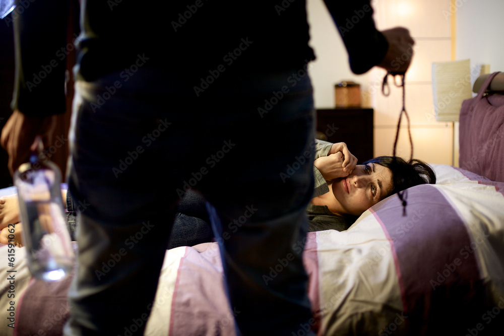 Fototapeta premium Woman scared of drunk husband