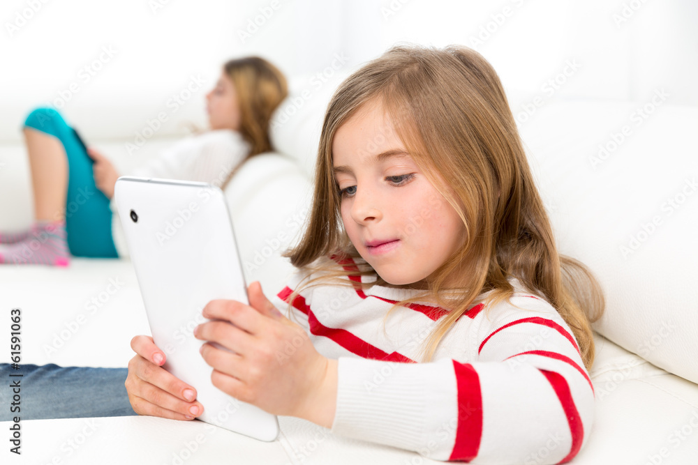 sister friends kid girls playing with tablet pc in sofa sister friends kid girls playing with tablet pc in sofa