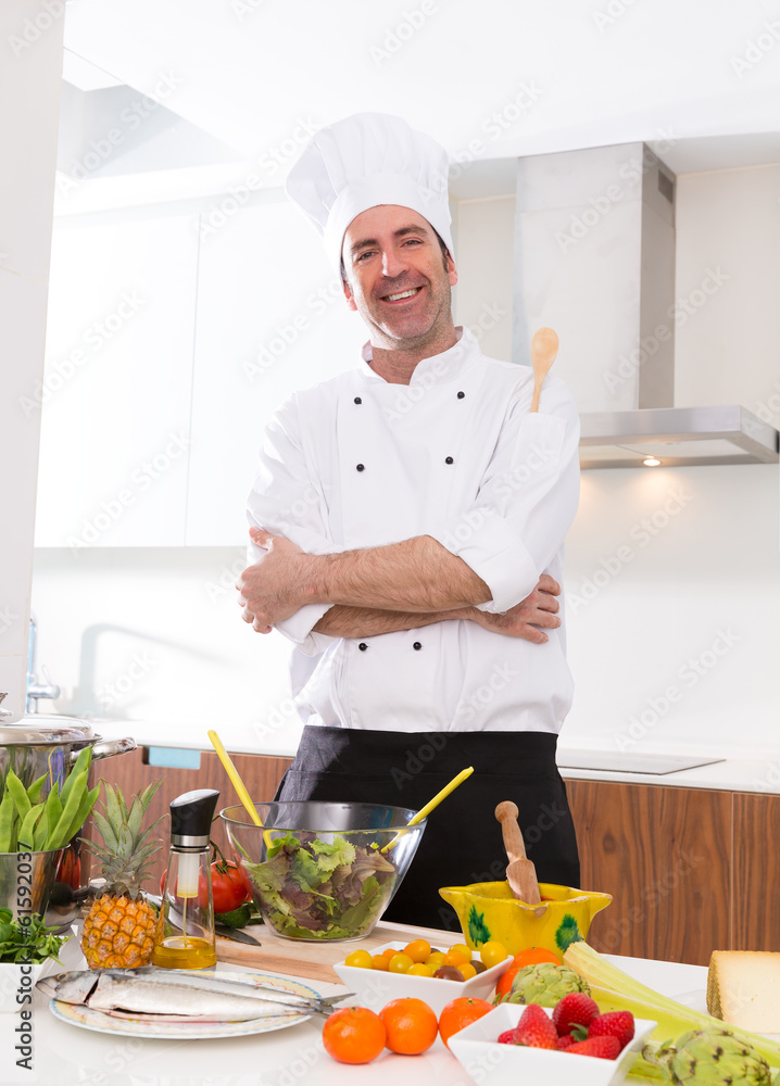 Chef male portrait on white countertop at kitchen Chef male portrait on white countertop at kitchen