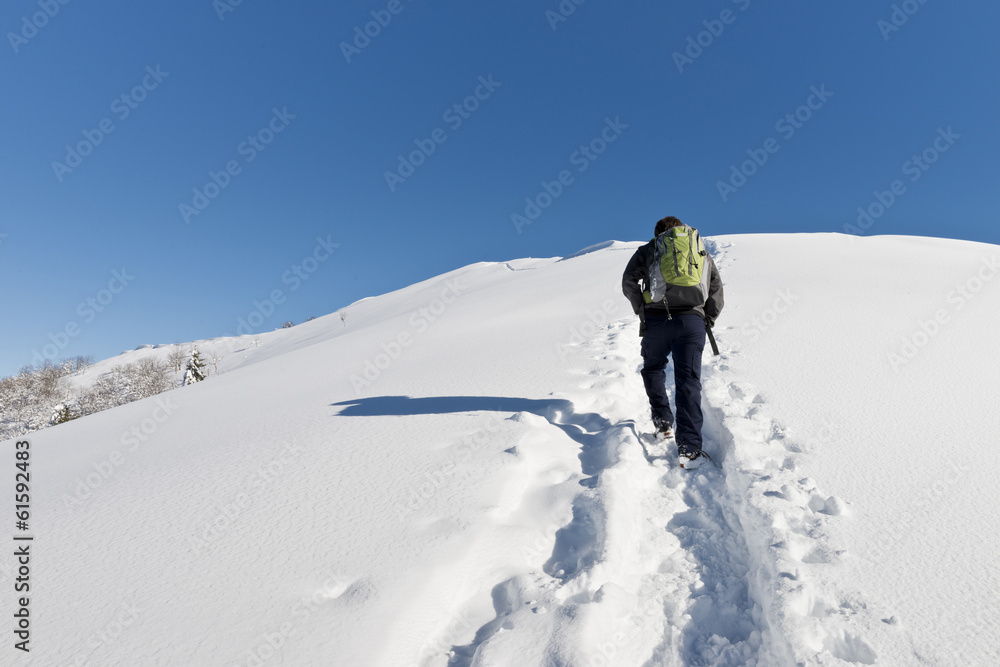 Man hiking in the snow