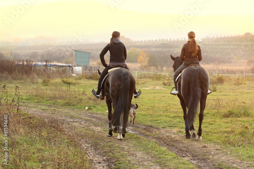 women riding horses