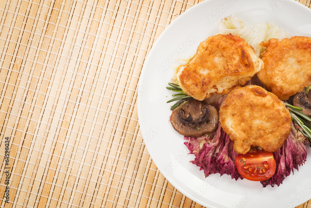 Fish in batter with fried mushrooms. Background Fish in batter with fried mushrooms. Background