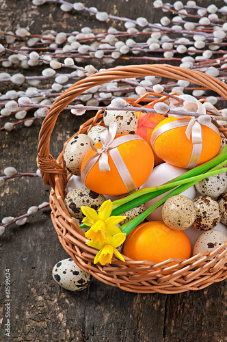 Colorful easter eggs on old wooden background
