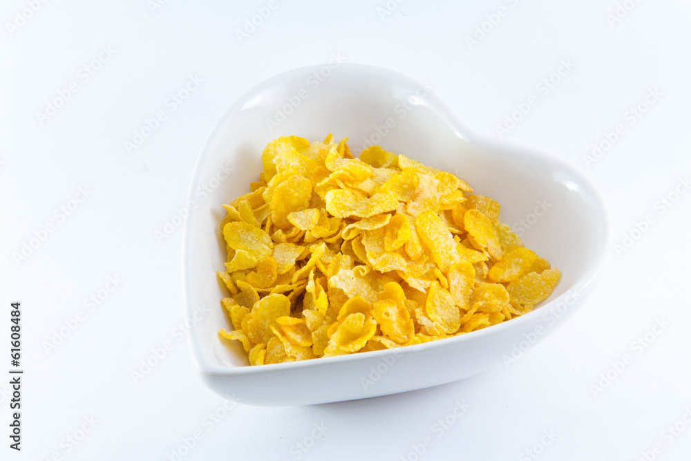 A bowl of nutritious and delicious corn flake cereal with milk A bowl of nutritious and delicious corn flake cereal with milk