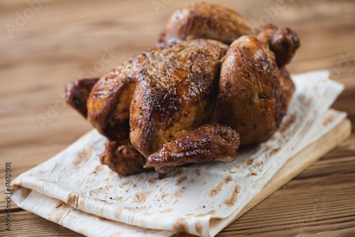 Smoked spicy chickling on pita bread, horizontal shot