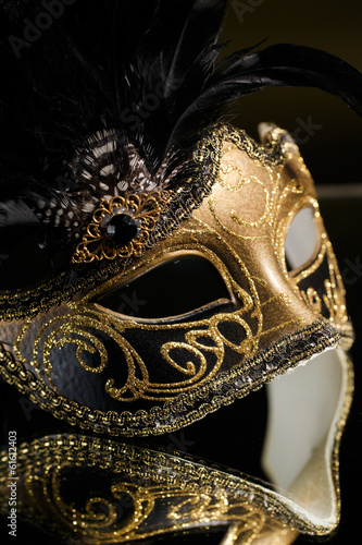 The Venetian masks with ornament over black background © GTeam