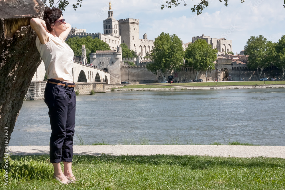 Woman against the backdrop of Avignon