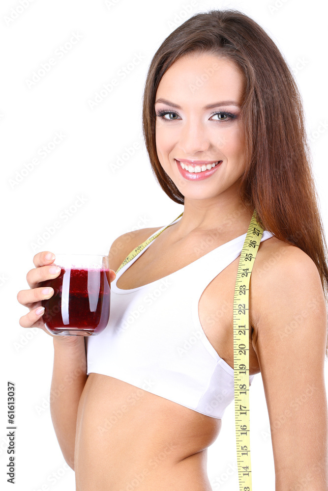 Beautiful girl with fresh juice and measuring tape isolated Beautiful girl with fresh juice and measuring tape isolated