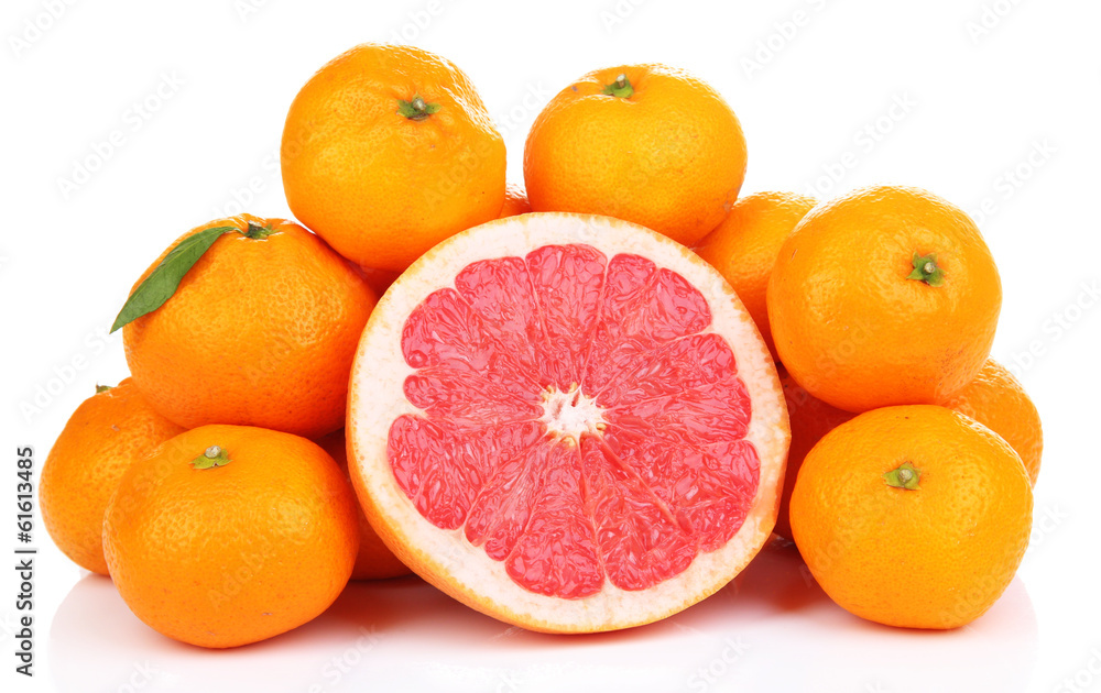 Ripe sweet tangerines and grapefruit, isolated on white Ripe sweet tangerines and grapefruit, isolated on white
