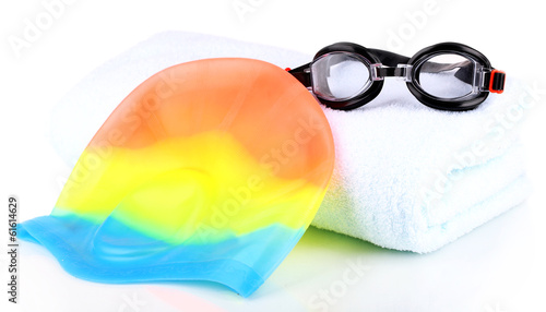 Set for pool: swim cap, goggles and towel isolated on white