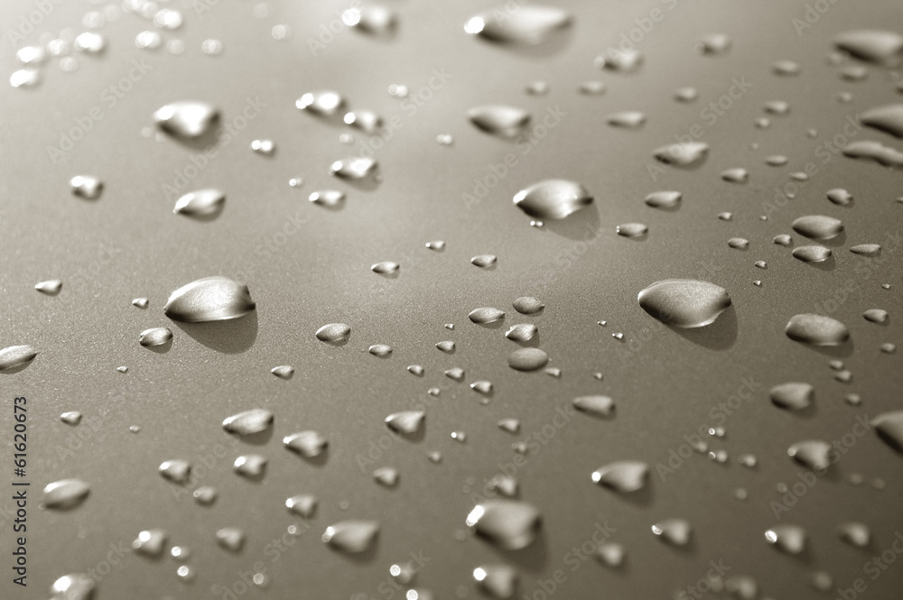 raindrops on a luxury metallic vehicle panel