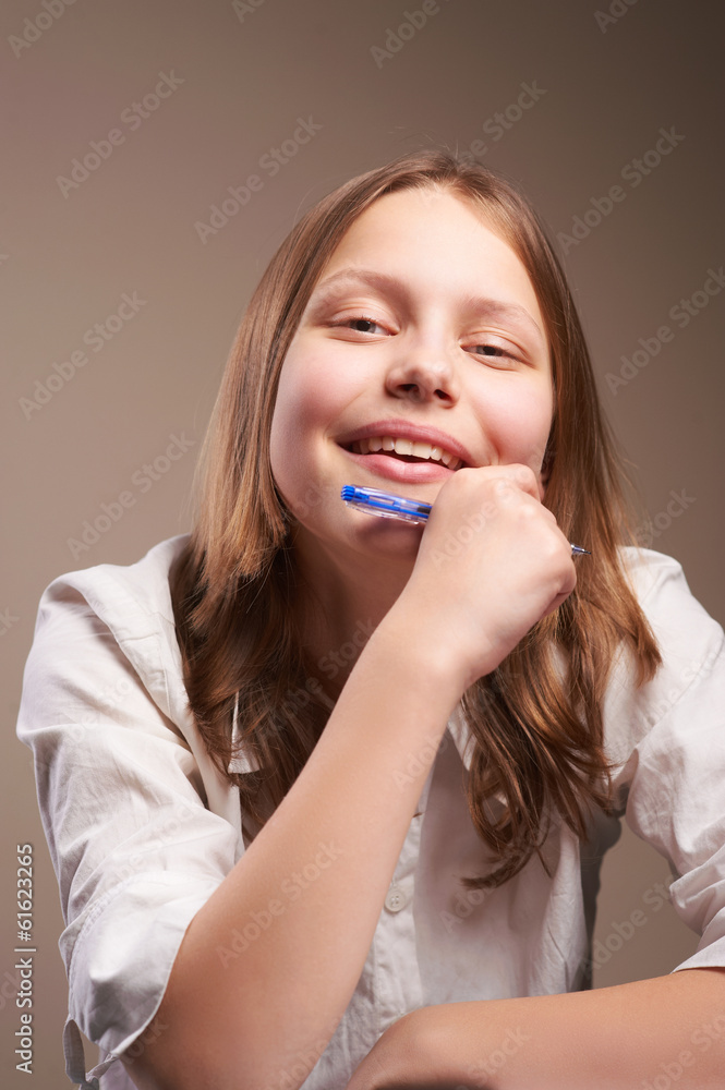 Cute smiling teen schoolgirl