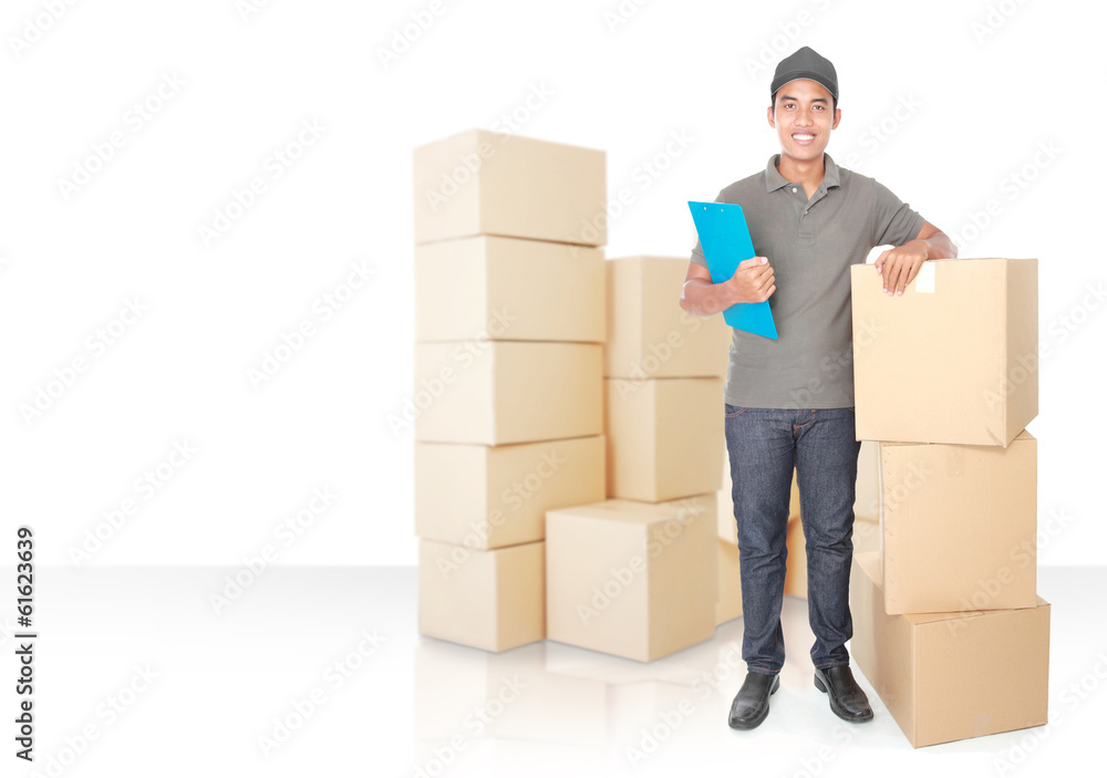 Smiling young delivery man with cardbox package Smiling young delivery man with cardbox package