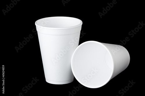 two styrofoam cups on black