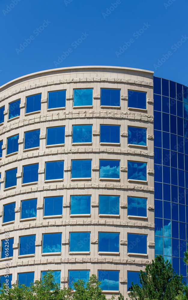 Curved Office with Clouds Reflected in Blue Glass Curved Office with Clouds Reflected in Blue Glass