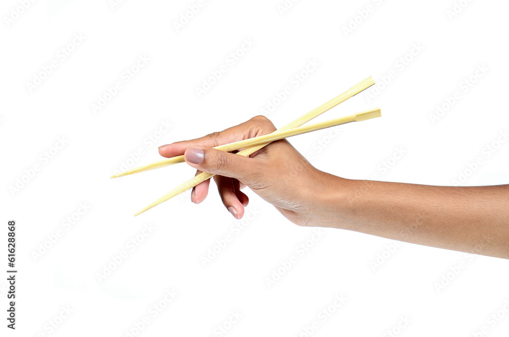 Chopsticks in a hand Chopsticks in a hand