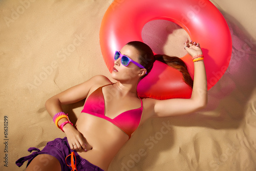 Beautiful Young Woman Sunbathing. Relax in the beach