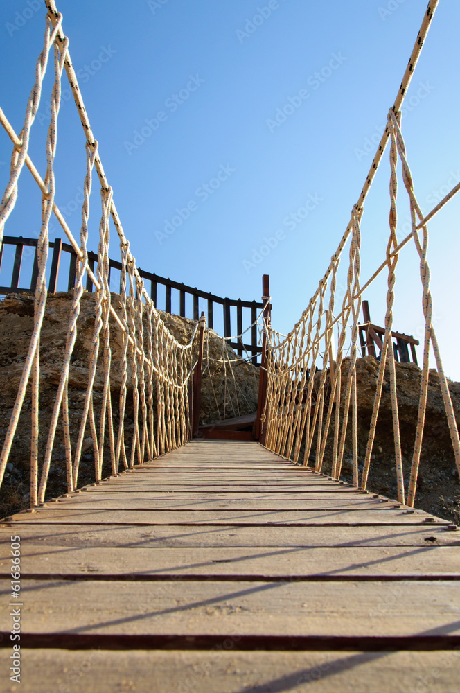 Obraz premium Rope bridge made of wooden planks