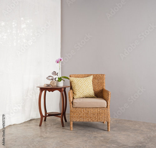 Rattan sofa chair in lounge setting