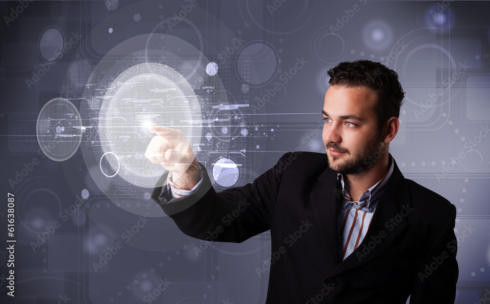 Attractive businessman touching abstract high technology circula Attractive businessman touching abstract high technology circula