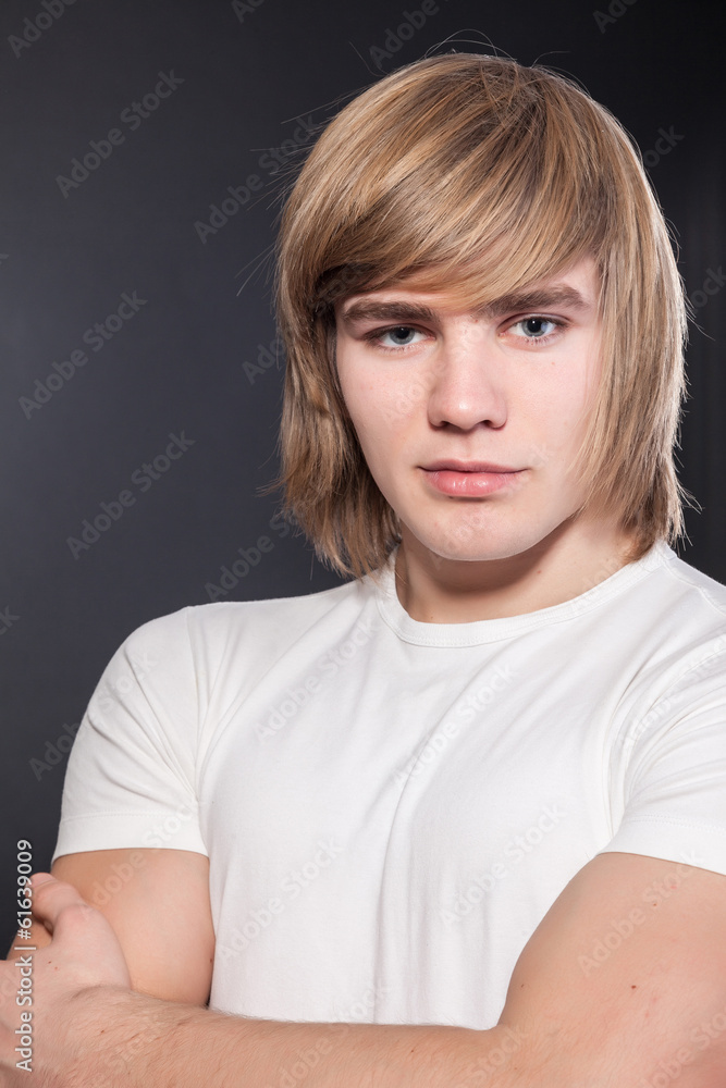 Healthy muscular young man on grey background Healthy muscular young man on grey background