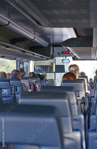 View from inside the bus with passengers.
