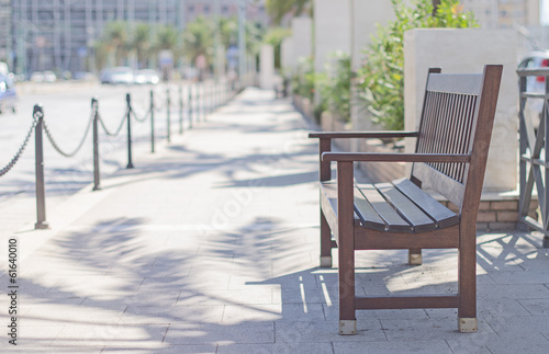 Empty bench in the city center. © M-Production