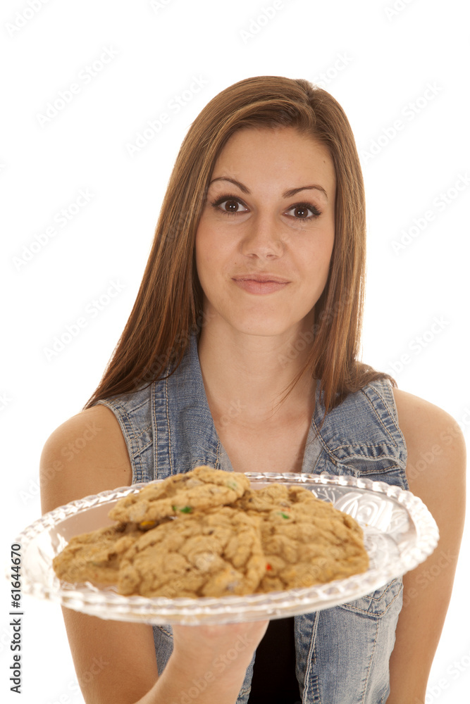 woman denim vest hold cookie plate woman denim vest hold cookie plate