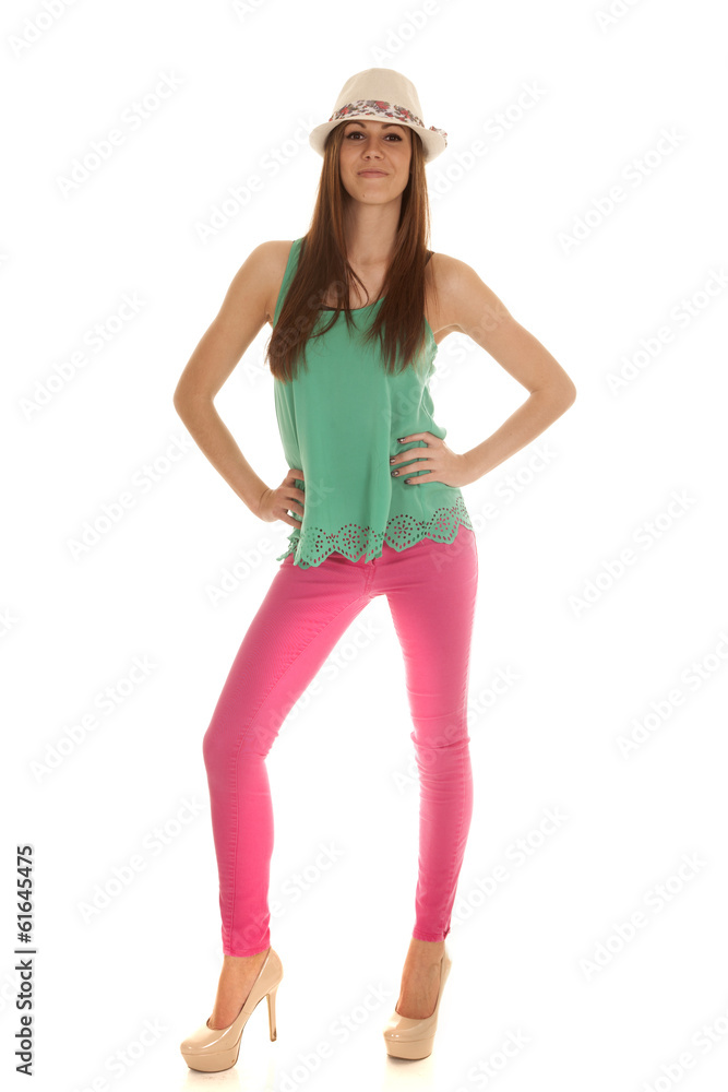woman green tank pink pants hat smile woman green tank pink pants hat smile