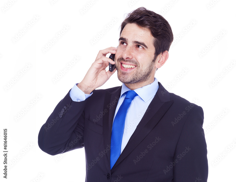Handsome business man talking on the phone, isolated on a white Handsome business man talking on the phone, isolated on a white