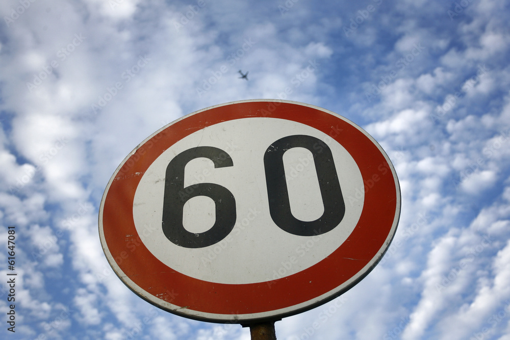 road sing speed limit on sixty