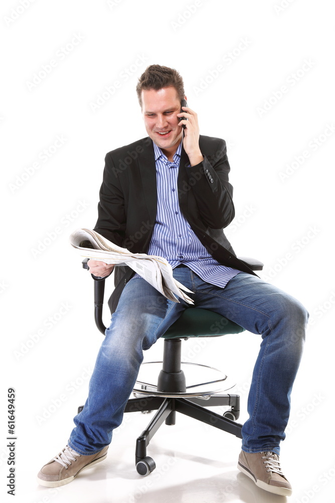 man reads newspaper phoning - economy news man reads newspaper phoning - economy news