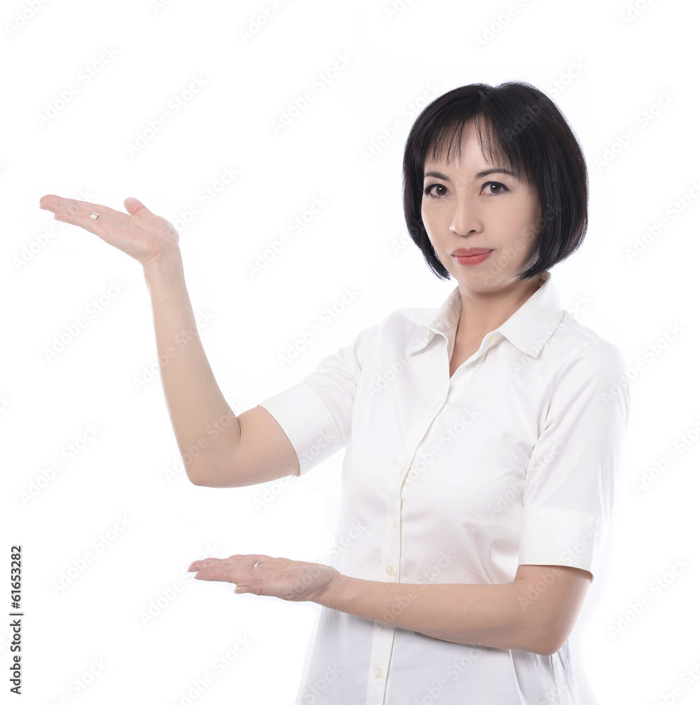 Middle aged corporate woman showing copy space to the camera Middle aged corporate woman showing copy space to the camera