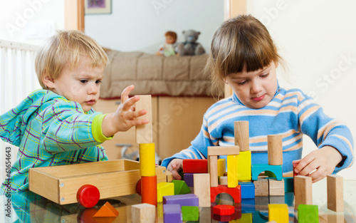 children  with wooden blocks