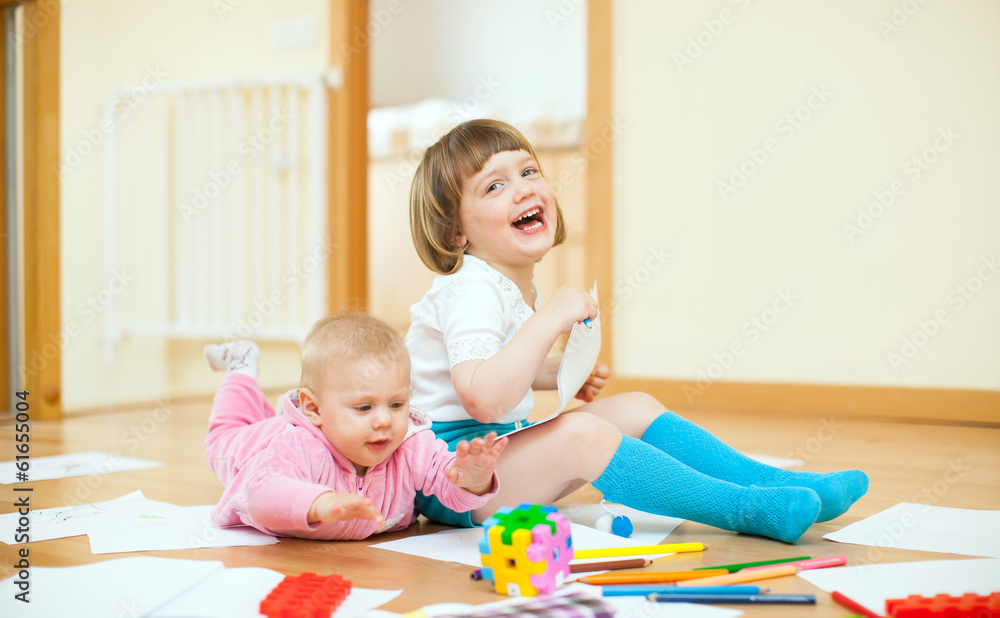 cheerful sibling plays in home