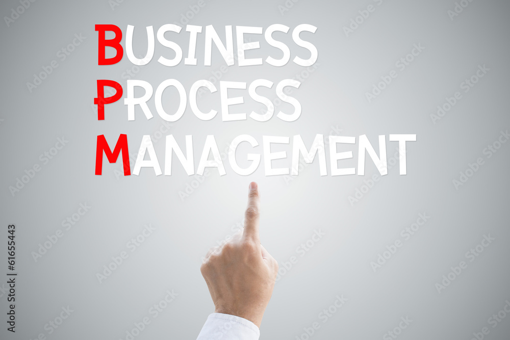Business process management hand press concept on grey backgroun Business process management hand press concept on grey backgroun