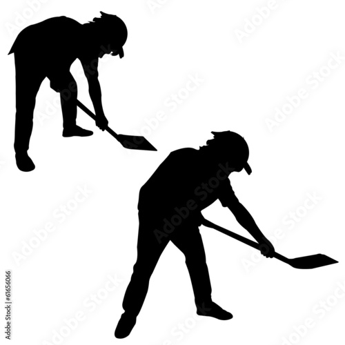 Silhouette of man with a spade