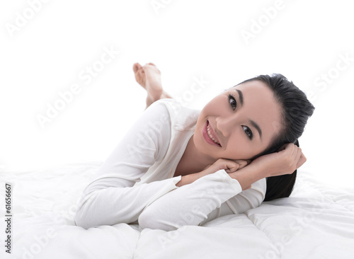 Beautiful woman Portrait of smiling lying in bed