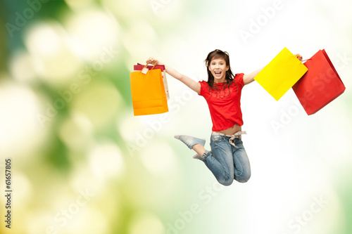 excited girl with shopping bags