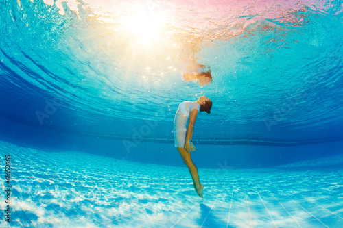 underwater swimming and reflection in water