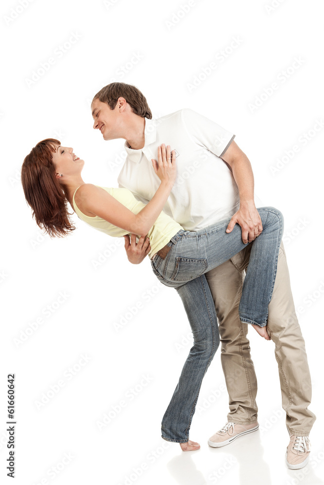 Young casual couple dancing.