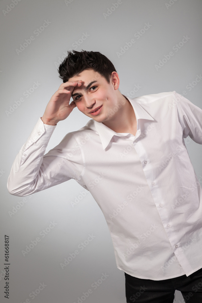 Healthy muscular young man on grey background Healthy muscular young man on grey background