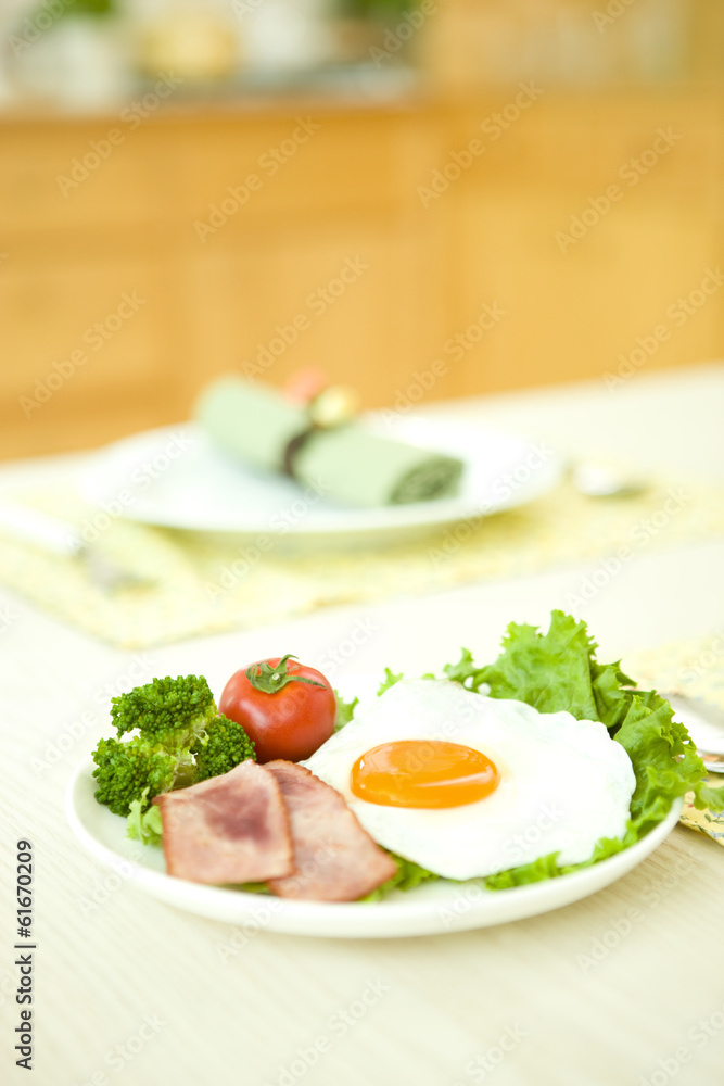 Fried egg with green leaf Fried egg with green leaf