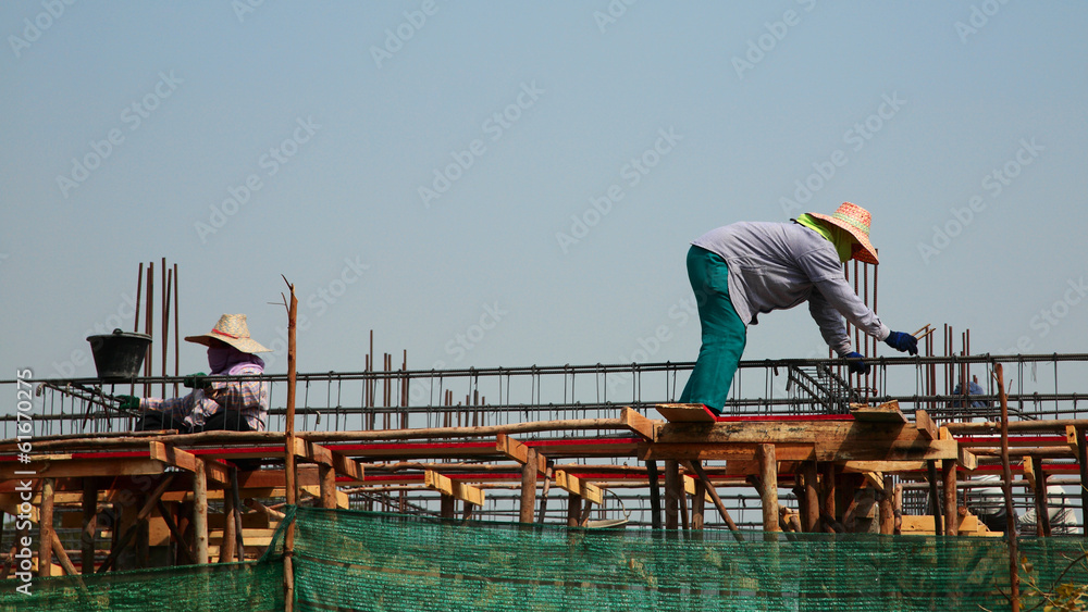 building worker working on construction roof