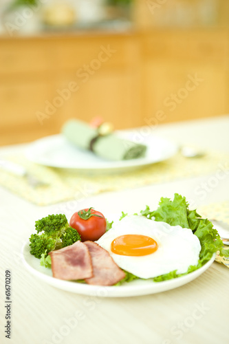 Fried egg with green leaf