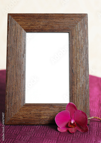 Empty picture frame and orchid